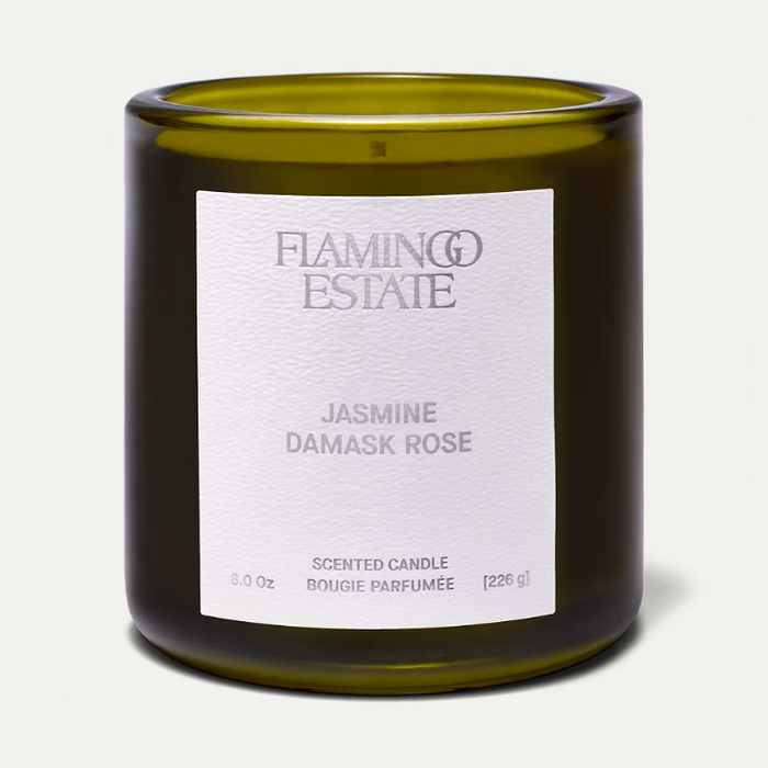 Flamingo Estate Jasmine Damask Rose candle in a green glass vessel
