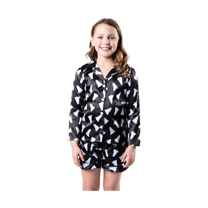 Girl in black satin pajamas with a white ghost print