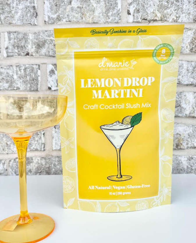 Lemon Drop Martini cocktail mix bag beside a yellow cocktail