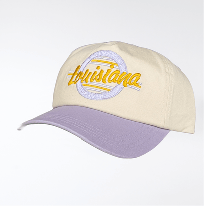 Cream baseball cap with a purple brim and embroidered Louisiana text in yellow