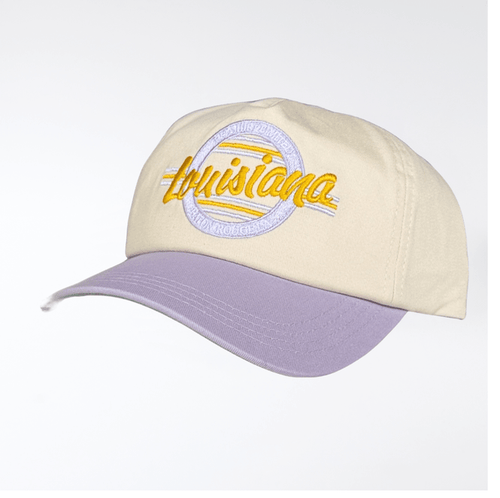 Cream baseball cap with a purple brim and embroidered Louisiana text in yellow