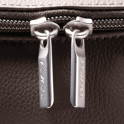 [Espresso] Close-up of a zipper pull on a textured surface