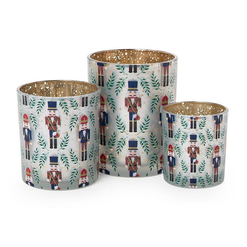Three nutcracker print glass tealight holders with mercury glass interiors