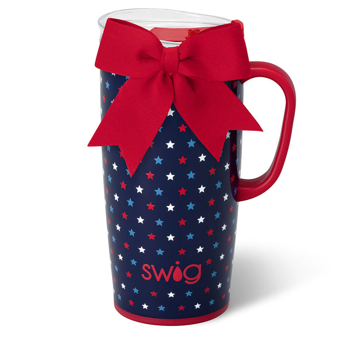Navy Swig travel mug with white stars and a red bow