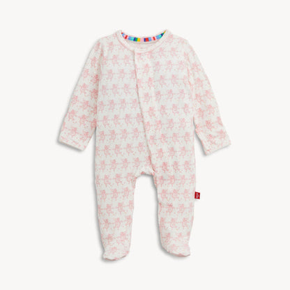 White baby sleepsuit with pink elephant print and rainbow trim