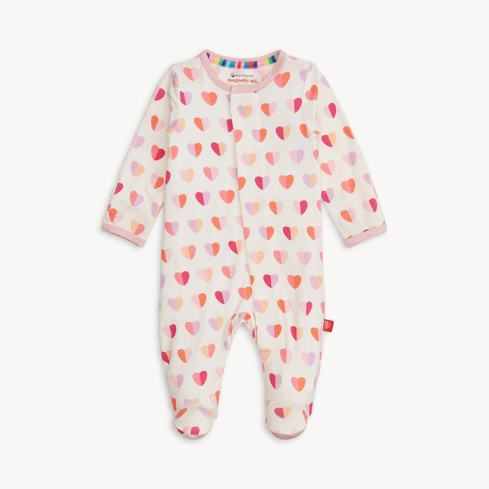 White baby footie with a colorful heart print
