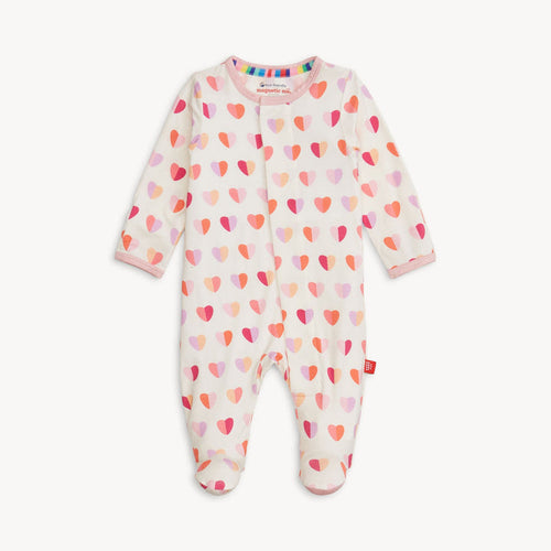 White baby footie with a colorful heart print