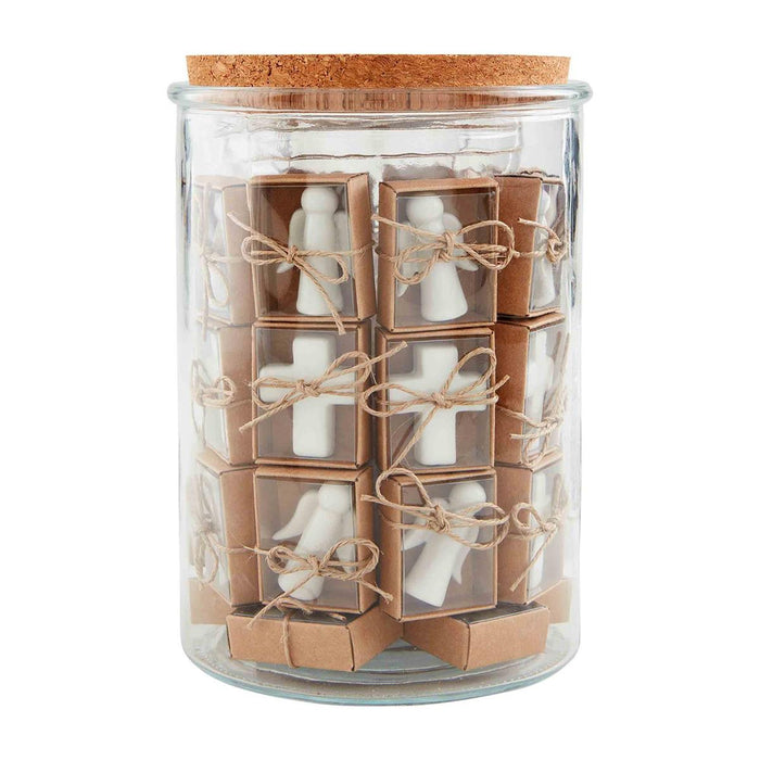 Glass jar of small white ceramic pocket tokens in kraft boxes
