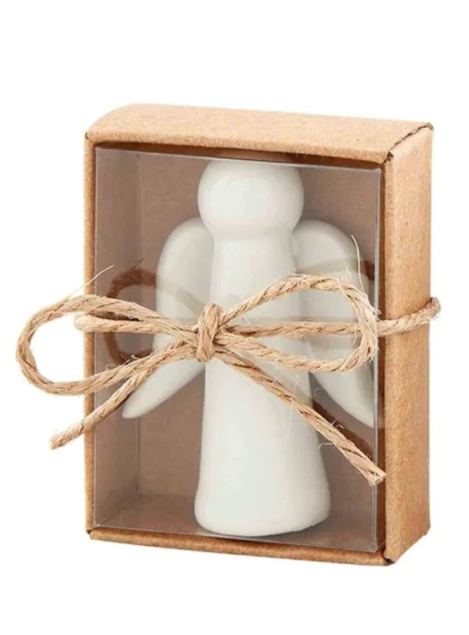 White ceramic angel pocket token in a kraft box tied with twine
