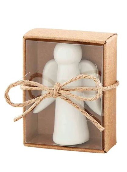 White ceramic angel pocket token in a kraft box tied with twine