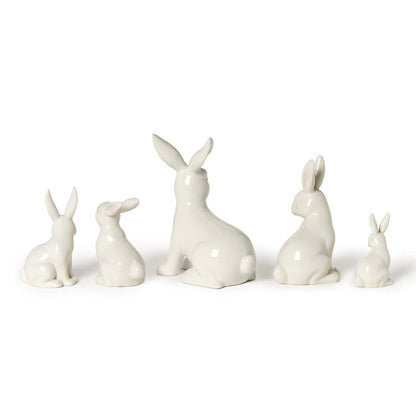 White porcelain bunny figures, side view