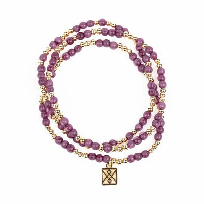 Purple and gold beaded wrap bracelet with a square charm