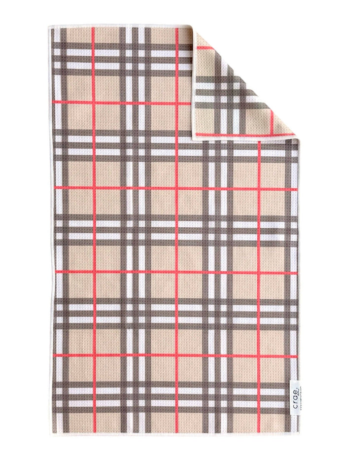 Hand towel with a pink, red and black plaid print