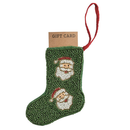 Green beaded mini stocking ornament with Santa faces holding a gift card