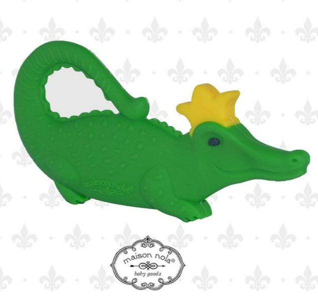 Green alligator silicone teether wearing a gold crown