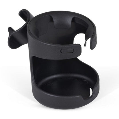 Close-up view of a black plastic cup holder attached to a stroller frame.