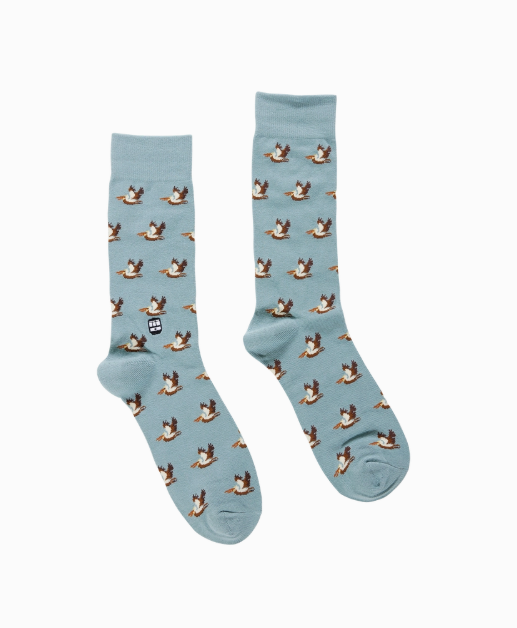 Light blue crew socks with a repeating pattern of flying pelicans