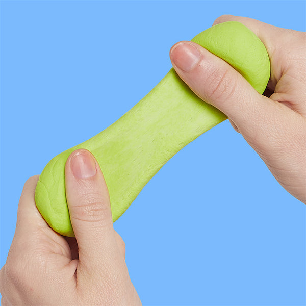 Hands stretching lime green putty