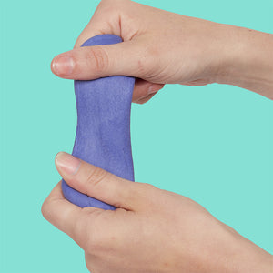Hands stretching periwinkle putty