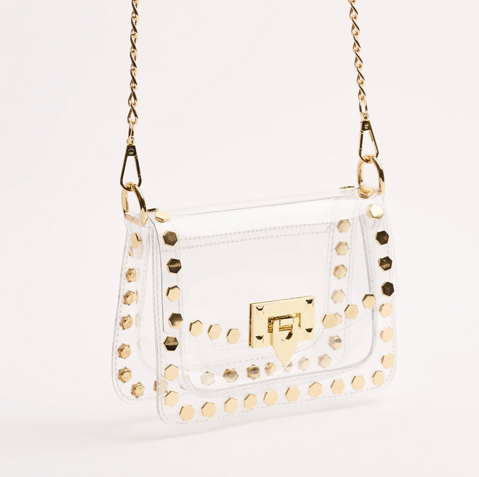 Side view of the clear gold-studded crossbody bag with gold chain