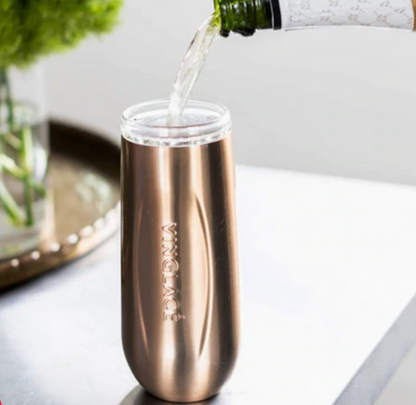 Champagne pouring into a rose gold insulated flute