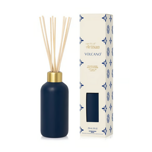 Capri Blue Volcano Terrazzo Velluto reed diffuser in a navy bottle beside its box
