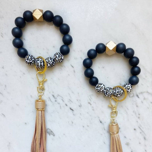 Black and cheetah print beaded wristlet keychains with gold tassels